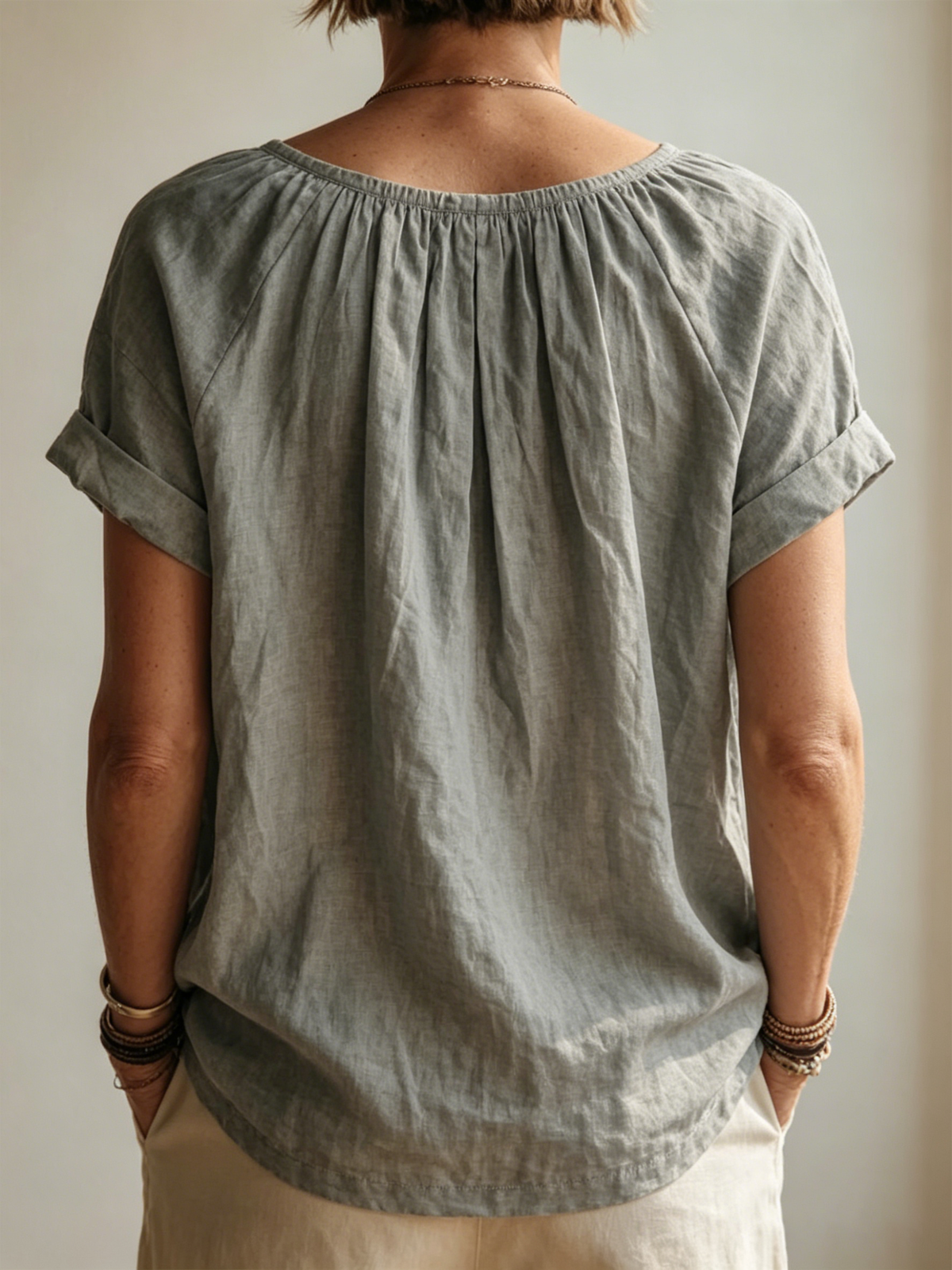 Garment-washed Grey Cotton-linen Top Featuring A Gathered U-neck, Partial Button Placket, Rolled Cuffs, And Short Sleeves.